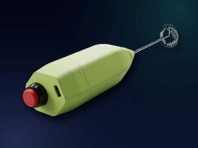 Studio render of the Coffee Beater: a green faceted housing with a red push button and USB-C port at one end and a coil whisk on a steel shaft